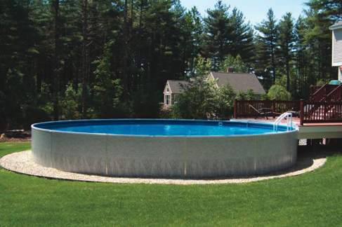 Waide’s Pools & Spas Freestanding Radiant above ground swimming pool with deck and ladder in East Erie, PA.