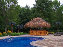 Beautifully landscaped outdoor living space developed around the in ground swimming pool installed by Waide’s Pools & Spas in Erie, PA.
